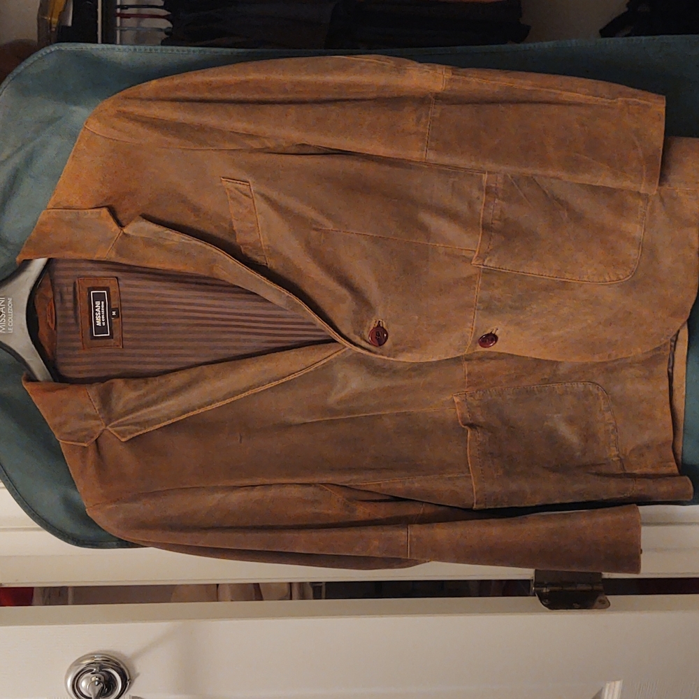 100% Lambskin leather blazer. Size medium.